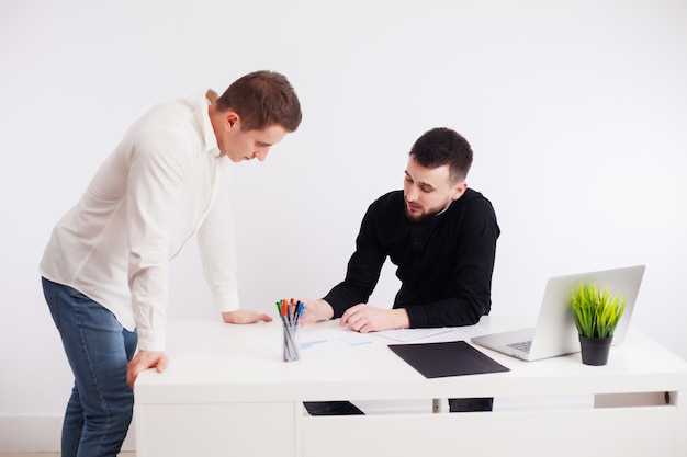 Workers arguing in the company office working together