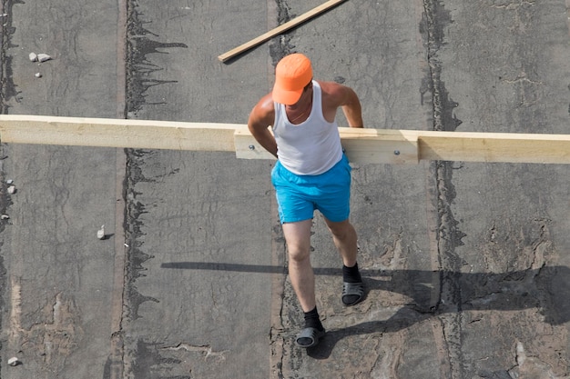 Workers building roof