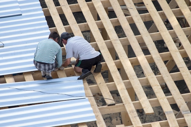 Workers building roof