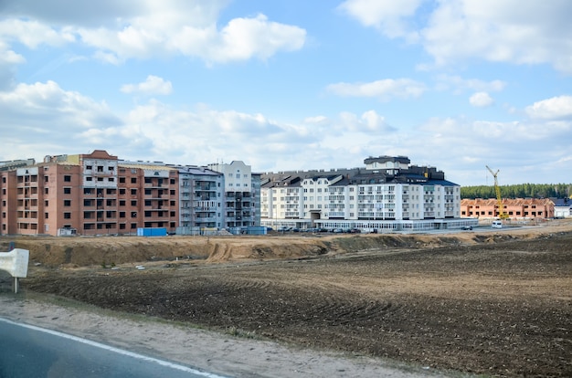 Workers erected a residential complex on the field.