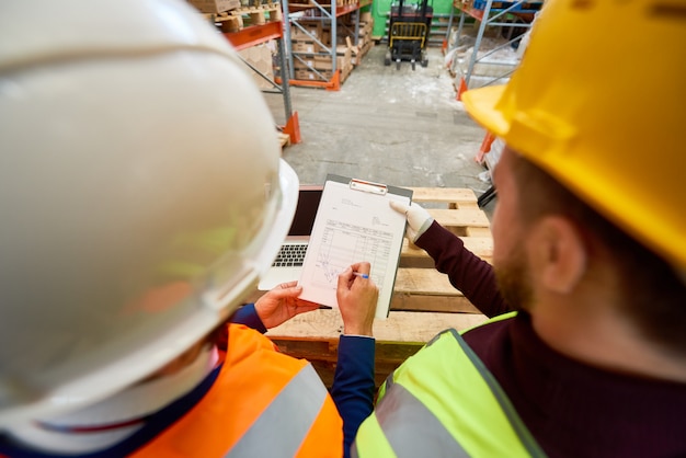 Photo workers looking at plans