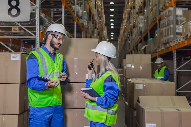 Workers in uniform doing their business in warehouse