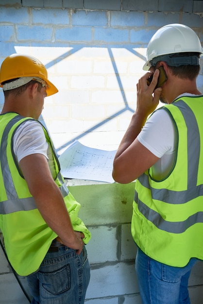 Workers with Floor Plans