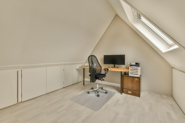 Working area on the top floor of a modern house with a computer on the table