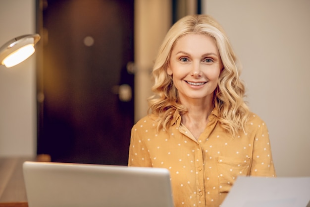 Working. Blonde stylish businesswoman working at the laptop