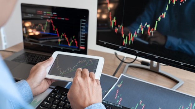 Working business man, team of broker or traders talking about forex on multiple computer screens