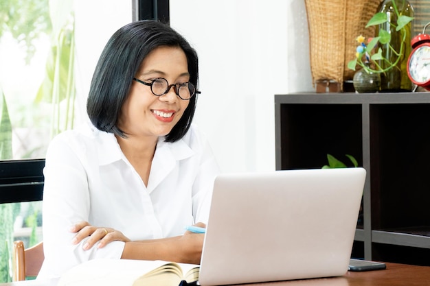 Photo working business woman sit indoor home office with labtop computer  concept of start up or work form home