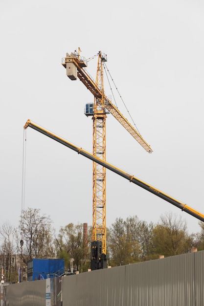 A working construction crane on a new building site