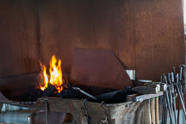 Working forge of the blacksmith in old shop.