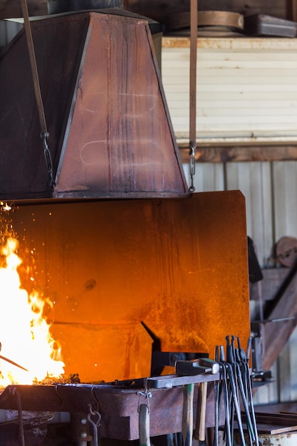 Working forge of the blacksmith in old shop.