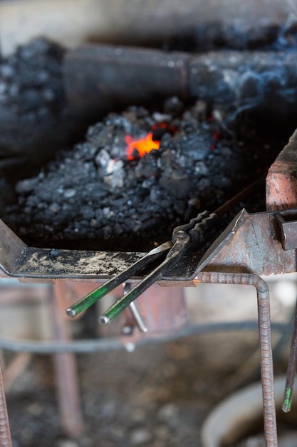 Working forge of the blacksmith in old shop.