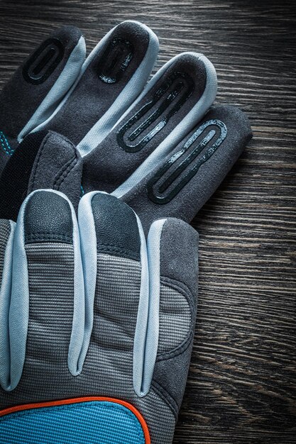 Working gloves on vintage wooden board