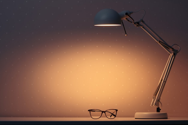 Photo a working lamp shines at night on a table with glasses.