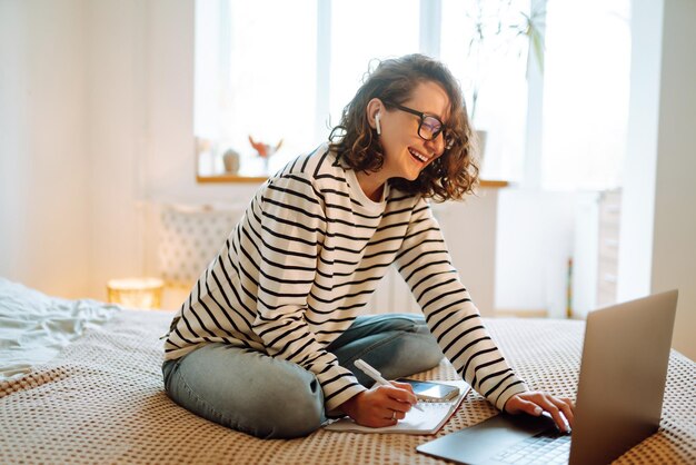 Working online. Female freelancer sitting at home and working on laptop Online shopping in web store