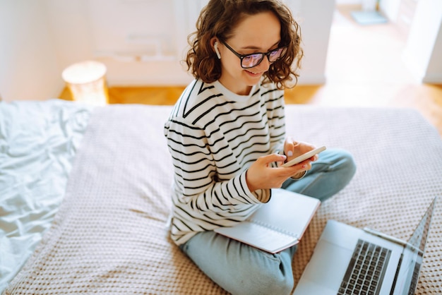 Working online. Female freelancer sitting at home and working on laptop Online shopping in web store