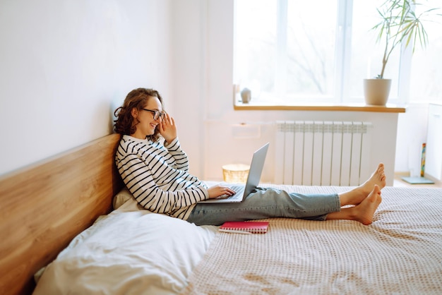 Working online. Female freelancer sitting at home and working on laptop Online shopping in web store