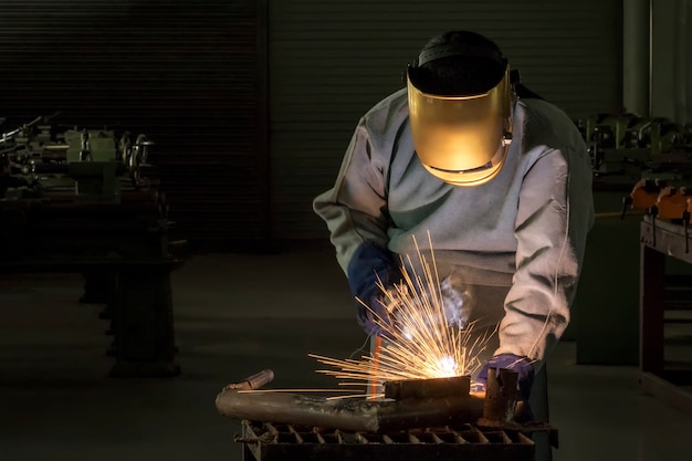 Working person industrial in factory welder steel