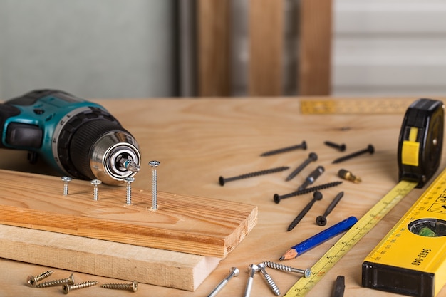 Photo working tool on a wooden table. set of tools.