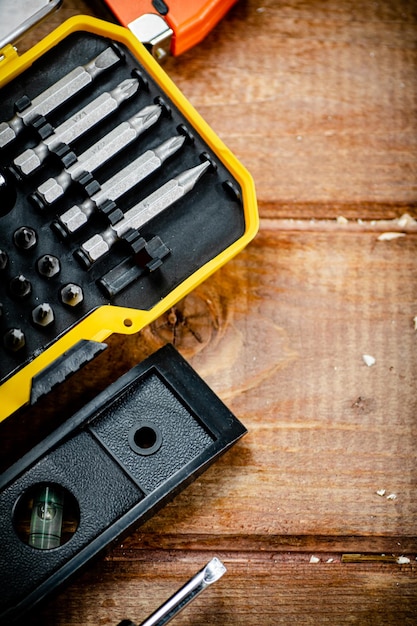 Working tools Screwdriver bits On a wooden background