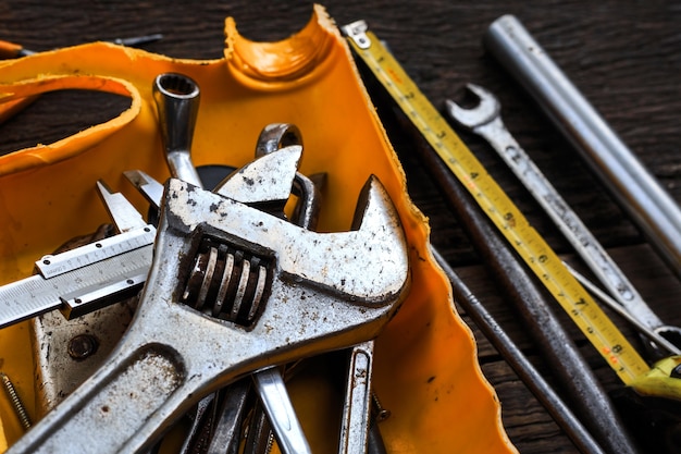 Working tools on wooden table background. top view