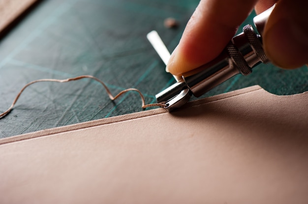 working with vegetable tanned leather. leather and the craft tools.