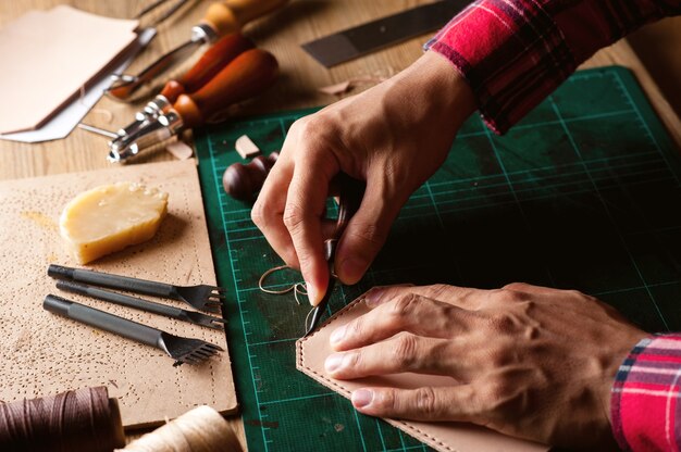 Working with vegetable tanned leather. Leather and the craft tools.