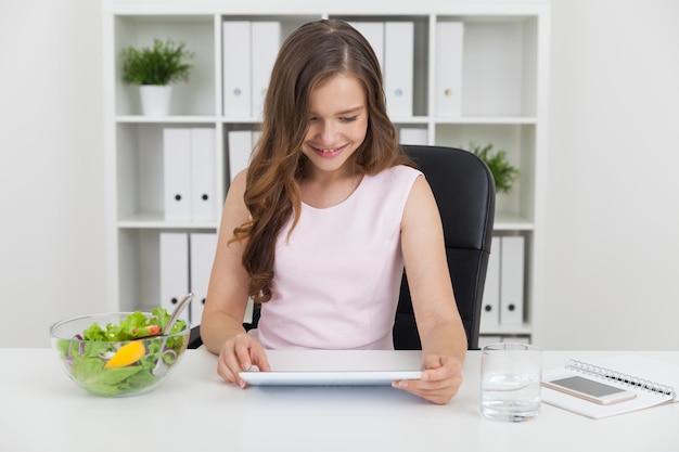 Working woman waiting for lunch break