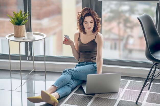 Working. Woman working on the floor