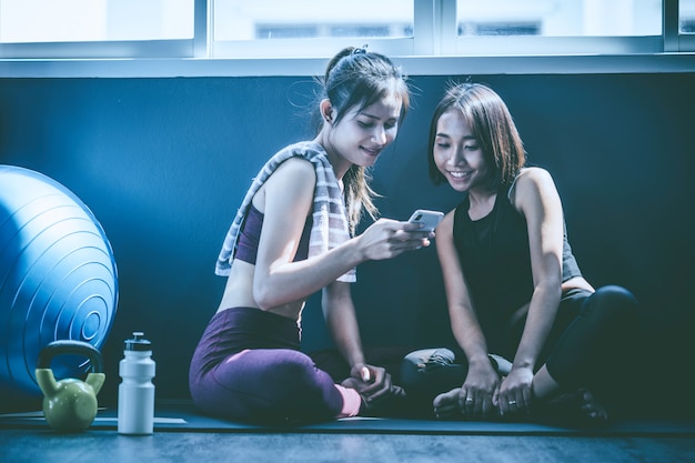 Workout concept; young woman feeling relax in yoga class