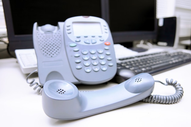 Workplace business person in the office. Phone and computer.