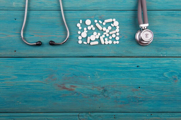 Workplace of doctor stethoscope and pills