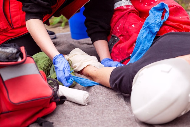 workplace hand injury first aid after accident on work at construction site