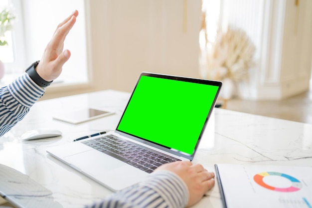 Workplace laptop open green screen Video call online communication virtual office