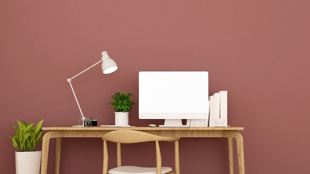 Workplace and light red wall decorate.