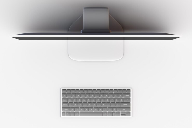 Photo workplace in the office monitor and computer keyboard top view