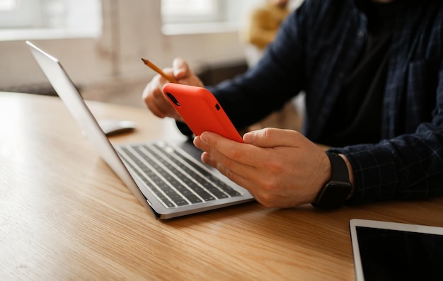 Workplace in the office with documents a man working on the
stock exchange uses a phone