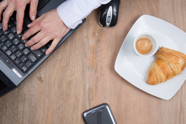 Workplace with computer and coffee