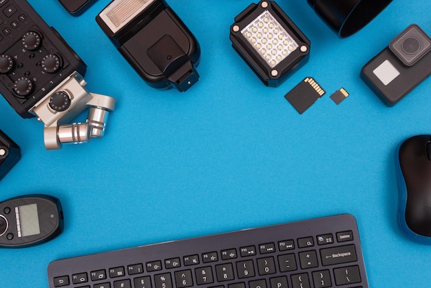 Workplace with digital gadgets on blue table