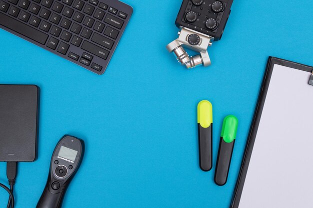 Workplace with digital gadgets on blue table