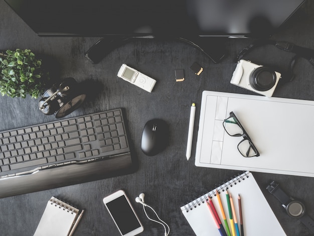 workplace with graphic tablet, smartphone, mouse, keyboard