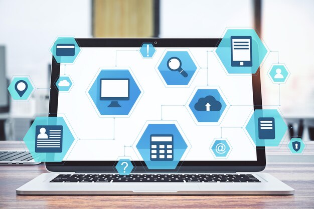 workplace with laptop and cloud computing diagram