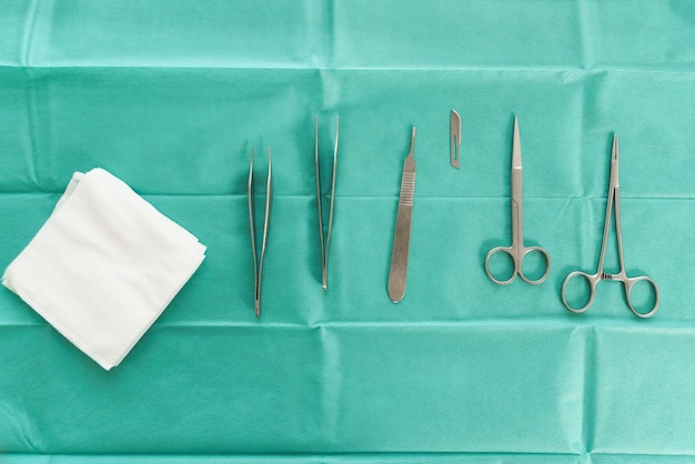 Photo workplace with surgical stainless steel tools in operating room