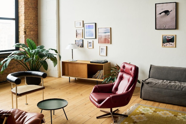 Workplace with two armchairs surrounding small round table in office