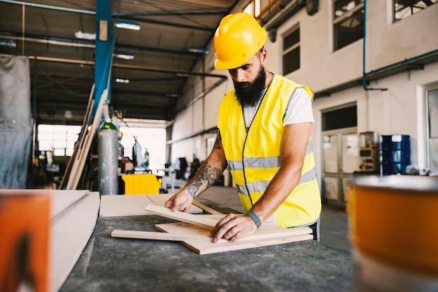 A workshop worker working with wood