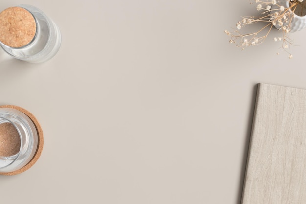 Photo workspace accessories and a cup of coffee on a beige table flat lay with blank copy space