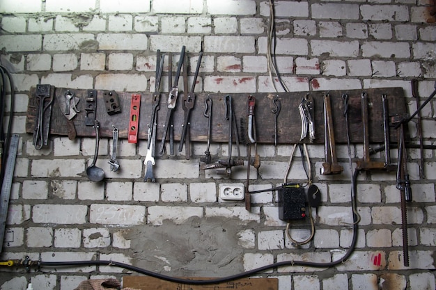 Workspace of blacksmith some tools on the wall