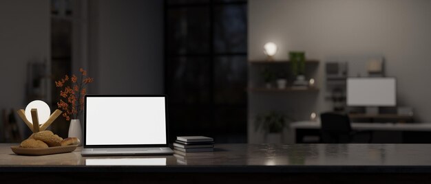 Workspace closeup with laptop mockup on tabletop in modern dark home office