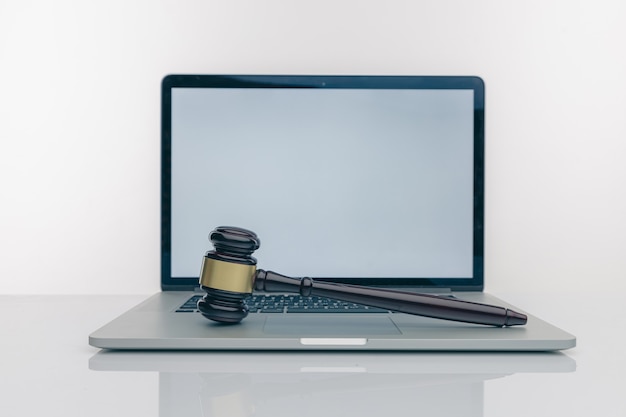 Workspace of lawyer with laptop blank white screen and law wooden gavel,legal book