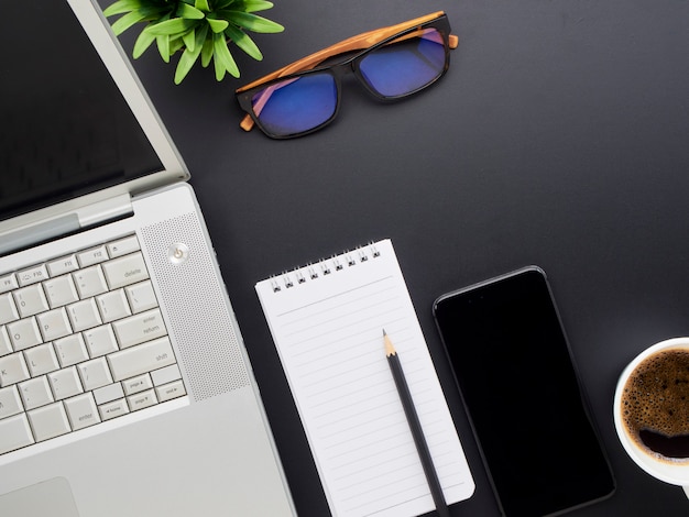 Workspace mockup on black desk.