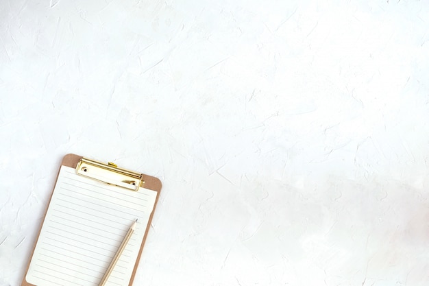 Workspace mockup, clipboard with blank paper, cotton branch